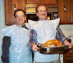 Don and Jerry prepare to carve the turkey.
